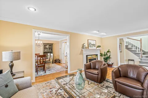 a living room with furniture or couch and a wooden floor