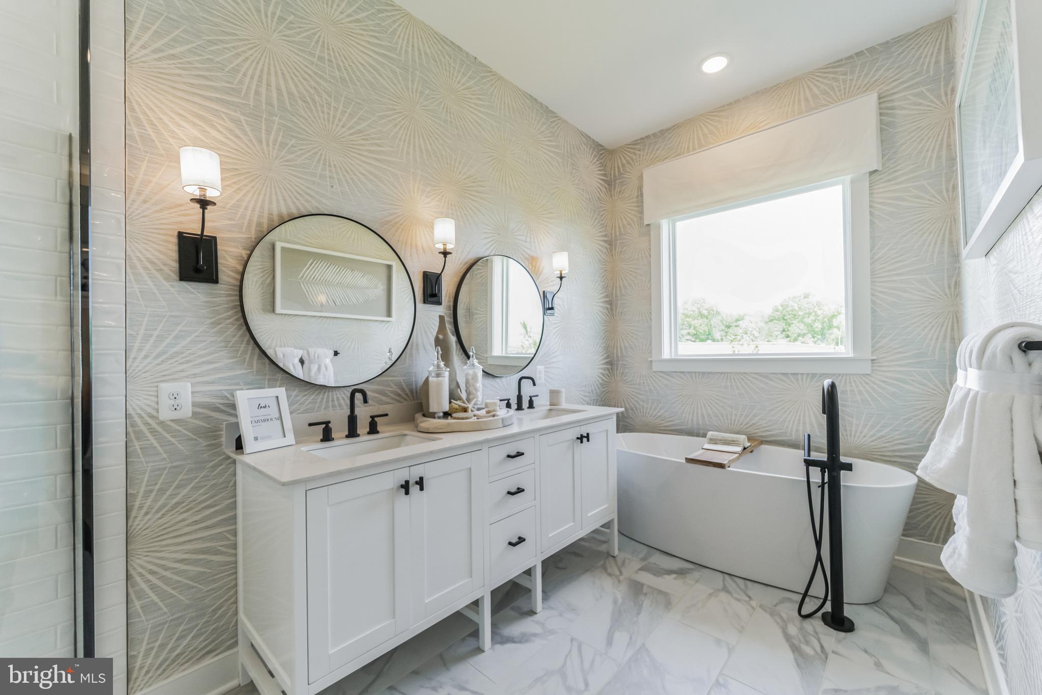 111 Flycatcher Way Stevensville, MD 21666 - Photo 12 of 48 a room with a mirror a sink and a window