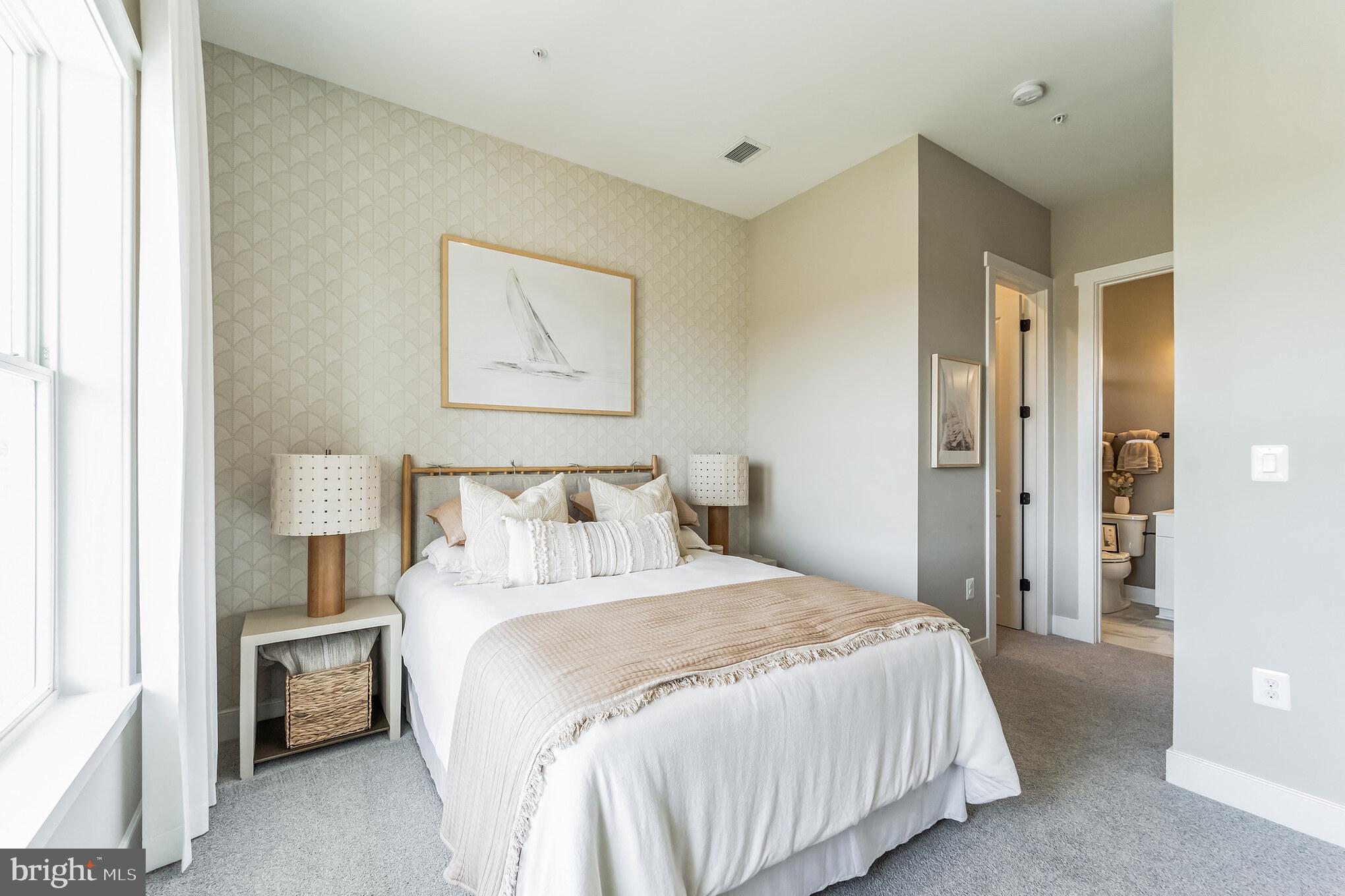 111 Flycatcher Way Stevensville, MD 21666 - Photo 14 of 48 a bedroom with a bed and a painting on the wall