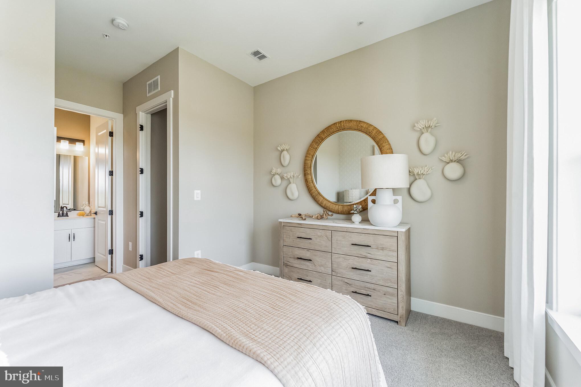 111 Flycatcher Way Stevensville, MD 21666 - Photo 15 of 48 a bedroom with a bed and a dresser