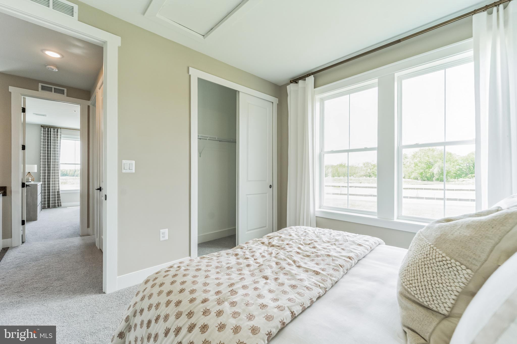 111 Flycatcher Way Stevensville, MD 21666 - Photo 18 of 48 a bedroom with a bed and a window