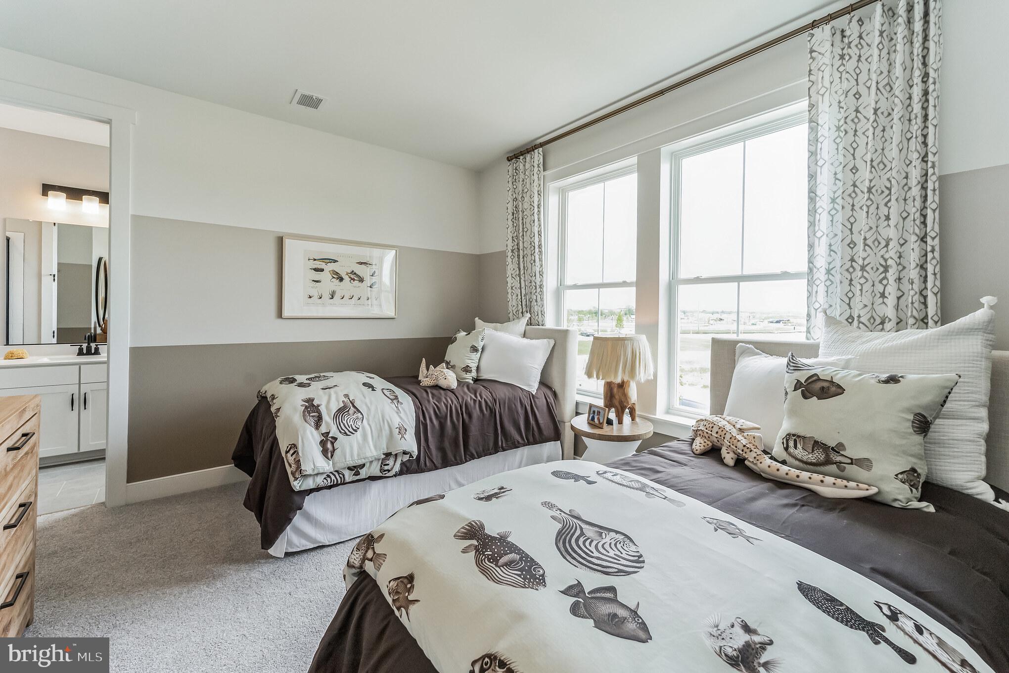 111 Flycatcher Way Stevensville, MD 21666 - Photo 21 of 48 a bedroom with bed and windows