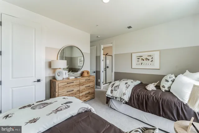 a bedroom with a bed and a dresser