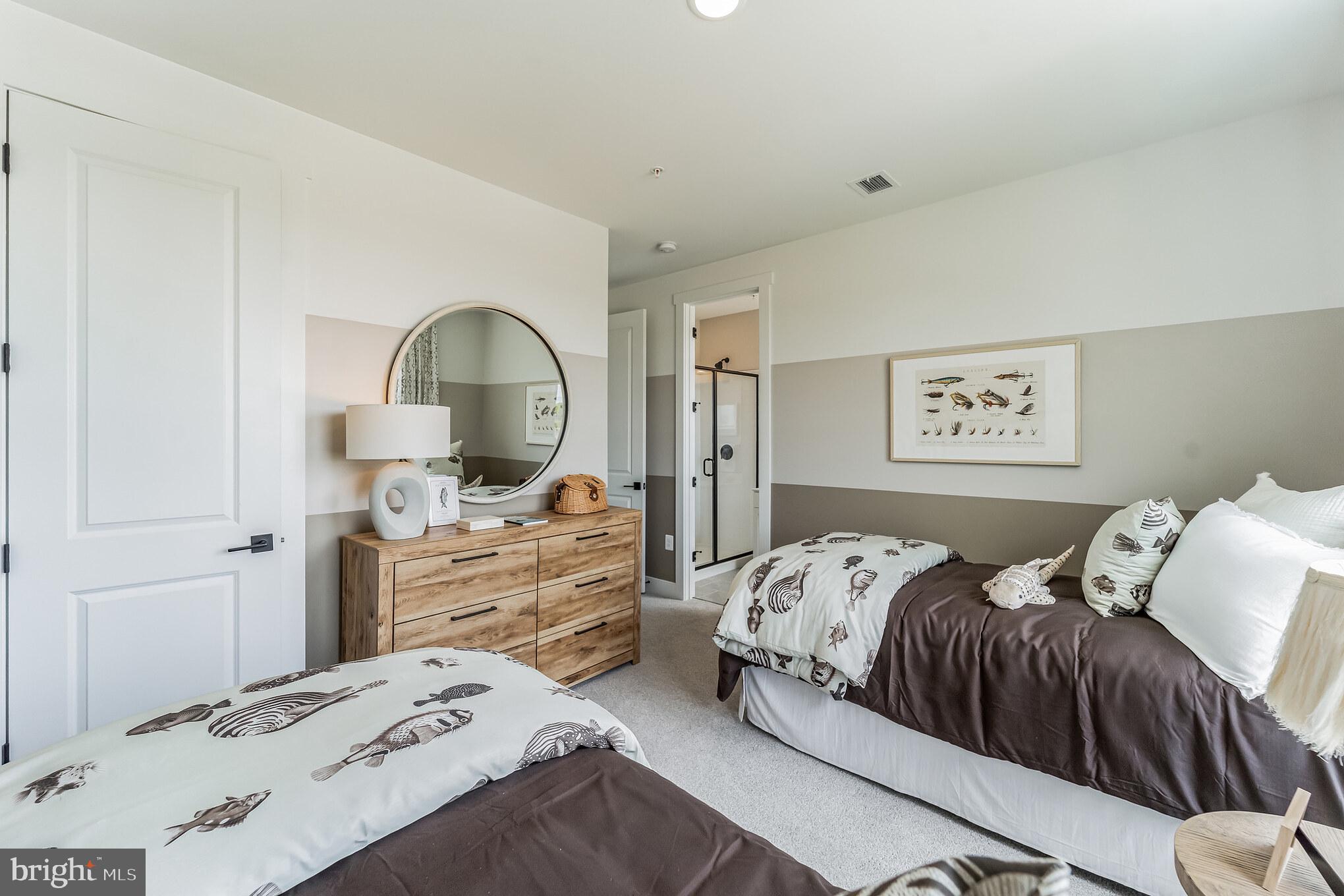 111 Flycatcher Way Stevensville, MD 21666 - Photo 22 of 48 a bedroom with a bed and a dresser