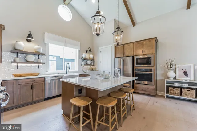a kitchen with a counter space cabinets and appliances