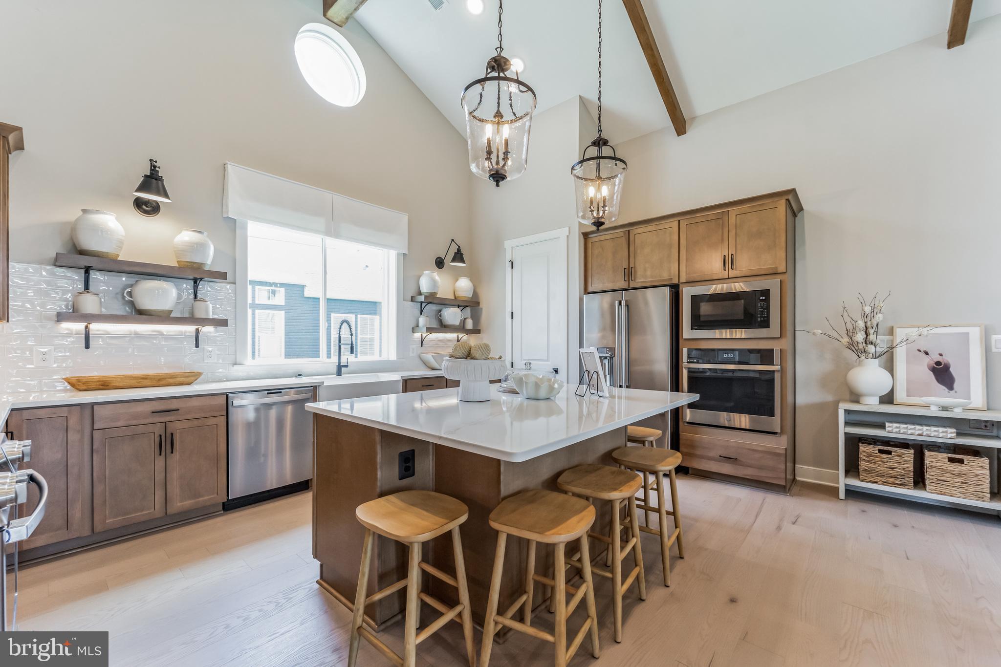 111 Flycatcher Way Stevensville, MD 21666 - Photo 4 of 48 a kitchen with a counter space cabinets and appliances