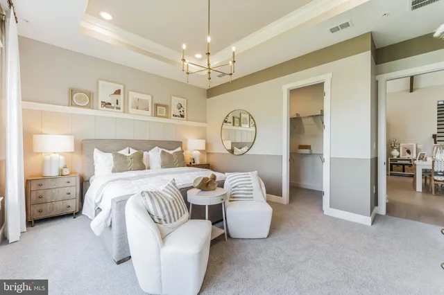 a bedroom with bed and wooden floor