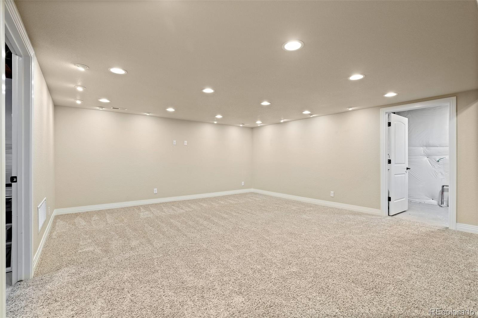 41865 East Muirfield Loop Elizabeth, CO 80107 - Photo 30 of 50 a view of an empty room with a fan