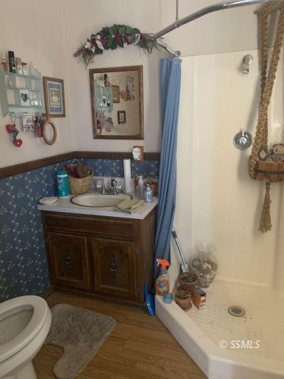 1221 North Garth Street Ridgecrest, CA 93555 - Photo 12 of 29 a bathroom with a sink a toilet and shower