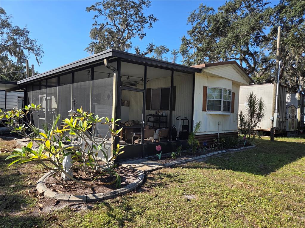 8828 Kanawha Road Riverview, FL 33578 - Photo 1 of 13 a backyard of a house with lots of green space