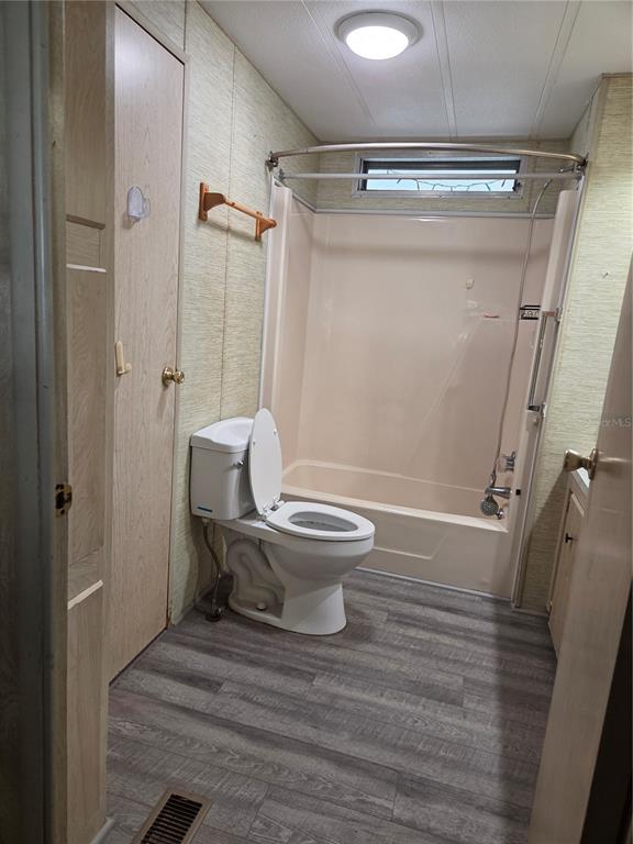 8828 Kanawha Road Riverview, FL 33578 - Photo 11 of 13 a bathroom with a toilet and a shower