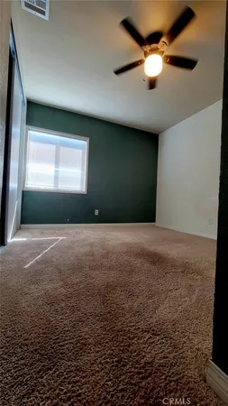 a view of livingroom with window and ceiling fan