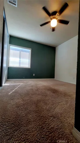 a view of livingroom with window and ceiling fan