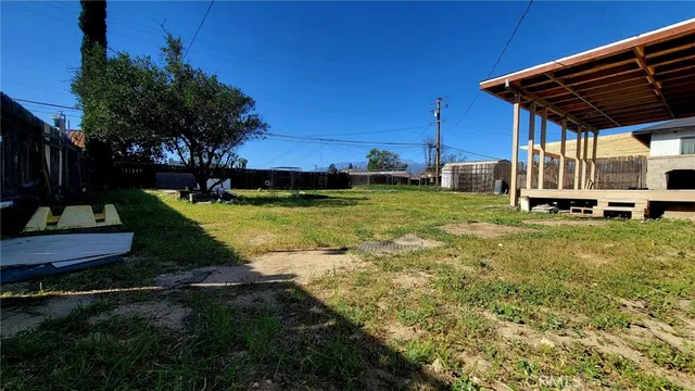 a view of a backyard with sitting area