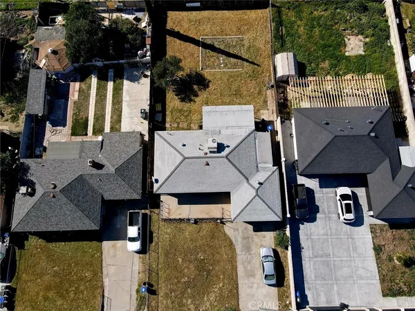 an aerial view of houses with outdoor space