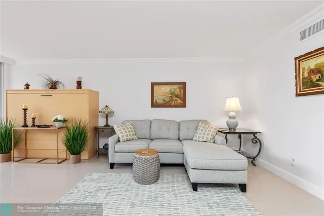 a living room with furniture and a lamp