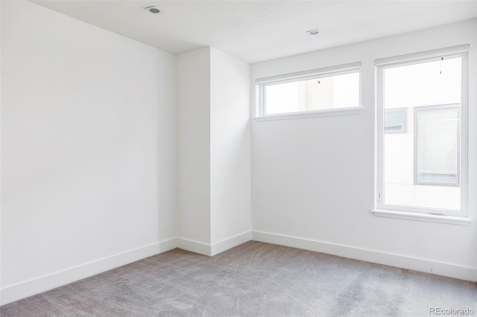 3619 Navajo Street Denver, CO 80211 - Photo 14 of 24 an empty room with windows