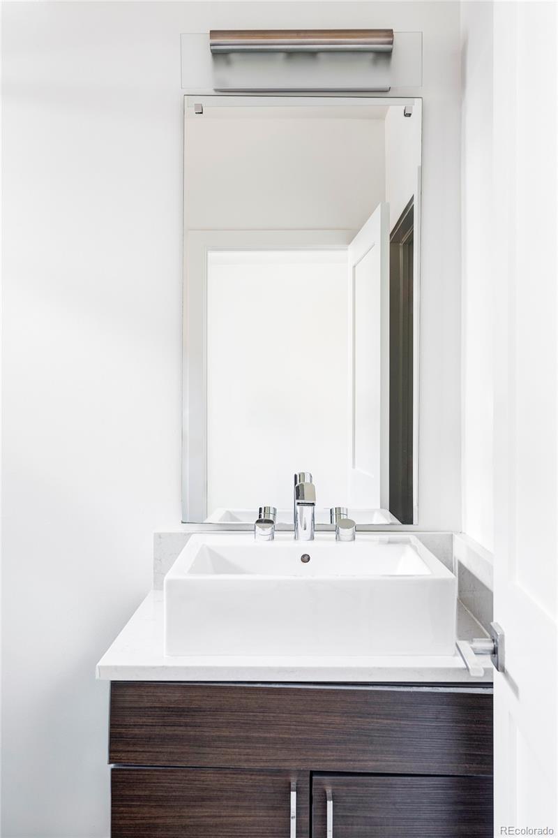 3619 Navajo Street Denver, CO 80211 - Photo 16 of 24 a bathroom with a sink and a mirror