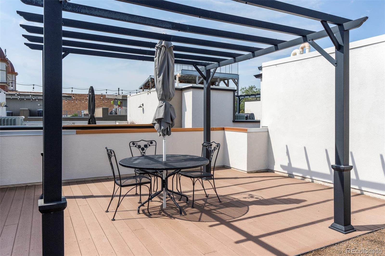 3619 Navajo Street Denver, CO 80211 - Photo 22 of 24 a view of a dining room with furniture and window