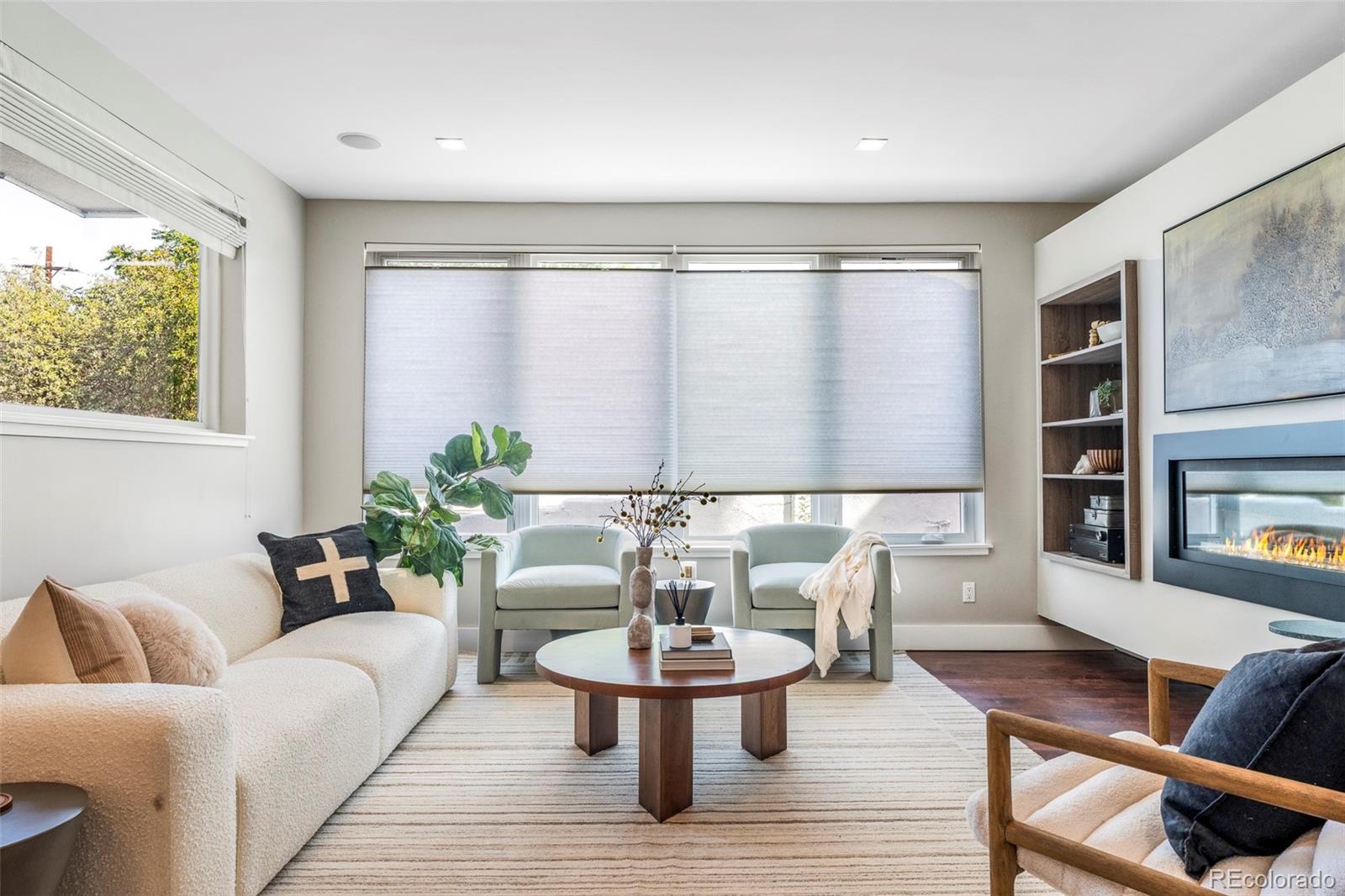 3619 Navajo Street Denver, CO 80211 - Photo 6 of 24 a living room with furniture and a large window