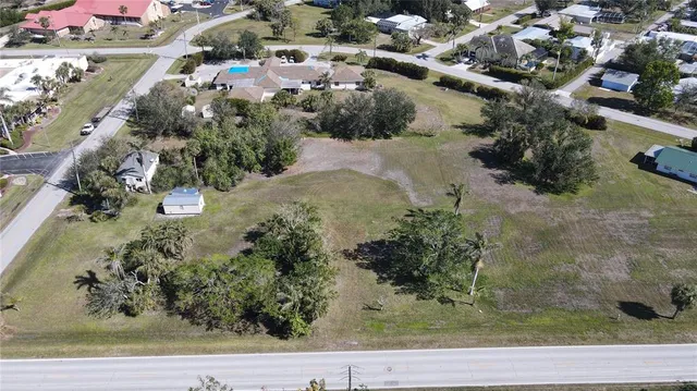 an aerial view of a residential houses with outdoor space