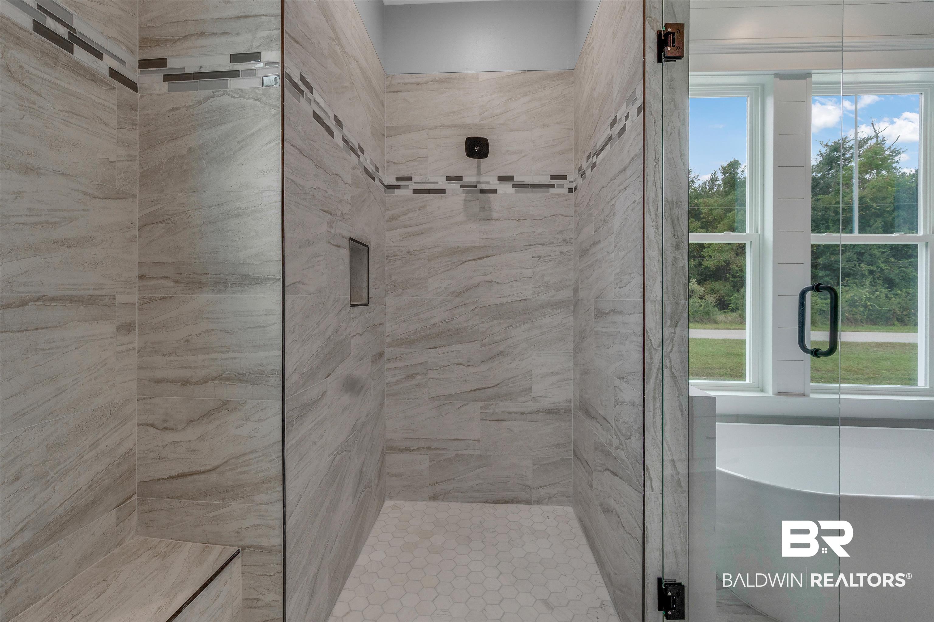 10985 Atrium Avenue Fairhope, AL 36532 - Photo 26 of 58 Bathroom featuring a stall shower and a freestanding tub