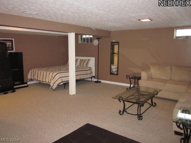 2411 Liberty Road Stow, OH 44224 - Photo 15 of 25 Terrific finished basement area. Energy efficient glass block windows. This could also be sectioned off to offer a 5th bedroom leaving plenty of family room to enjoy.