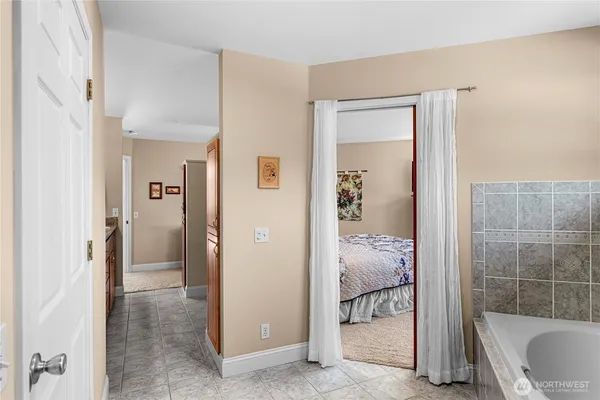 a bathroom with a tub and shower