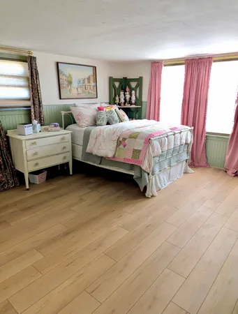 a bedroom with a bed and a dresser