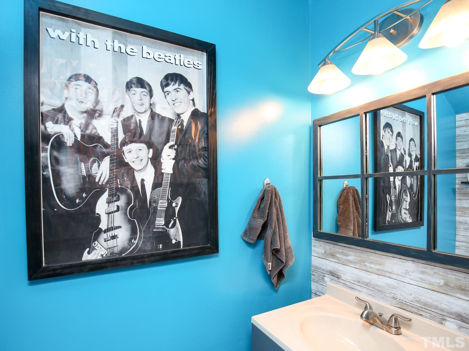 5423 Pine Top Circle Raleigh, NC 27612 - Photo 12 of 30 a bathroom with a sink and a mirror