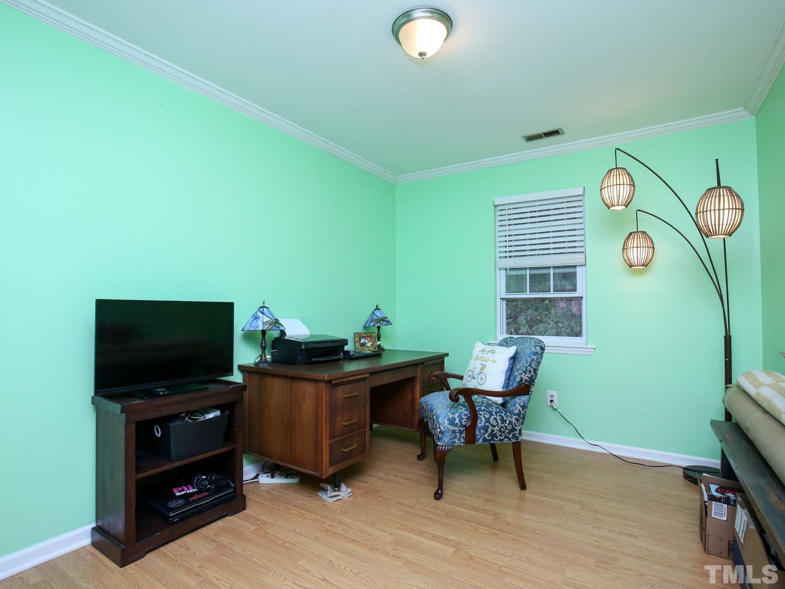 5423 Pine Top Circle Raleigh, NC 27612 - Photo 22 of 30 a living room with furniture and a flat screen tv