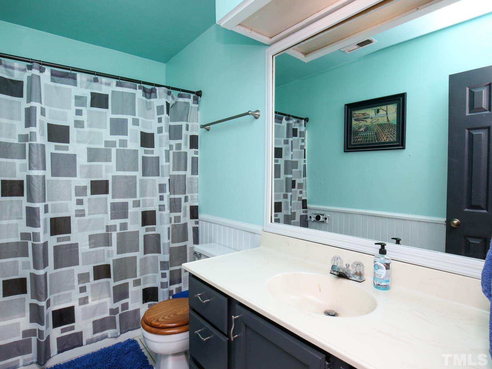 5423 Pine Top Circle Raleigh, NC 27612 - Photo 24 of 30 a bathroom with a sink toilet and shower