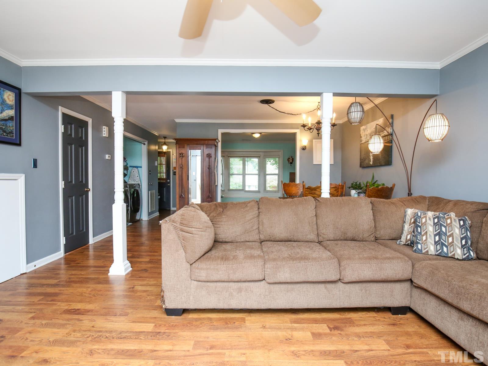 5423 Pine Top Circle Raleigh, NC 27612 - Photo 4 of 30 a living room with furniture and large windows