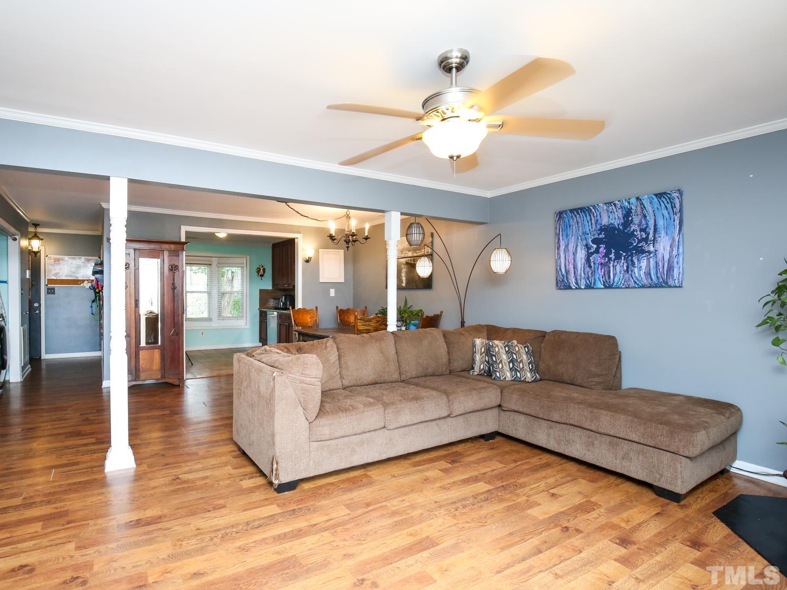 5423 Pine Top Circle Raleigh, NC 27612 - Photo 5 of 30 a living room with furniture and a large mirror with wooden floor