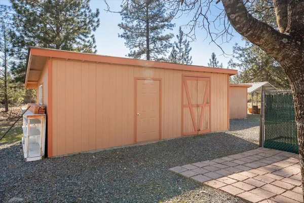 a view of a backyard of the house