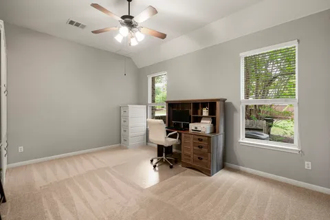 a workspace with furniture and a window