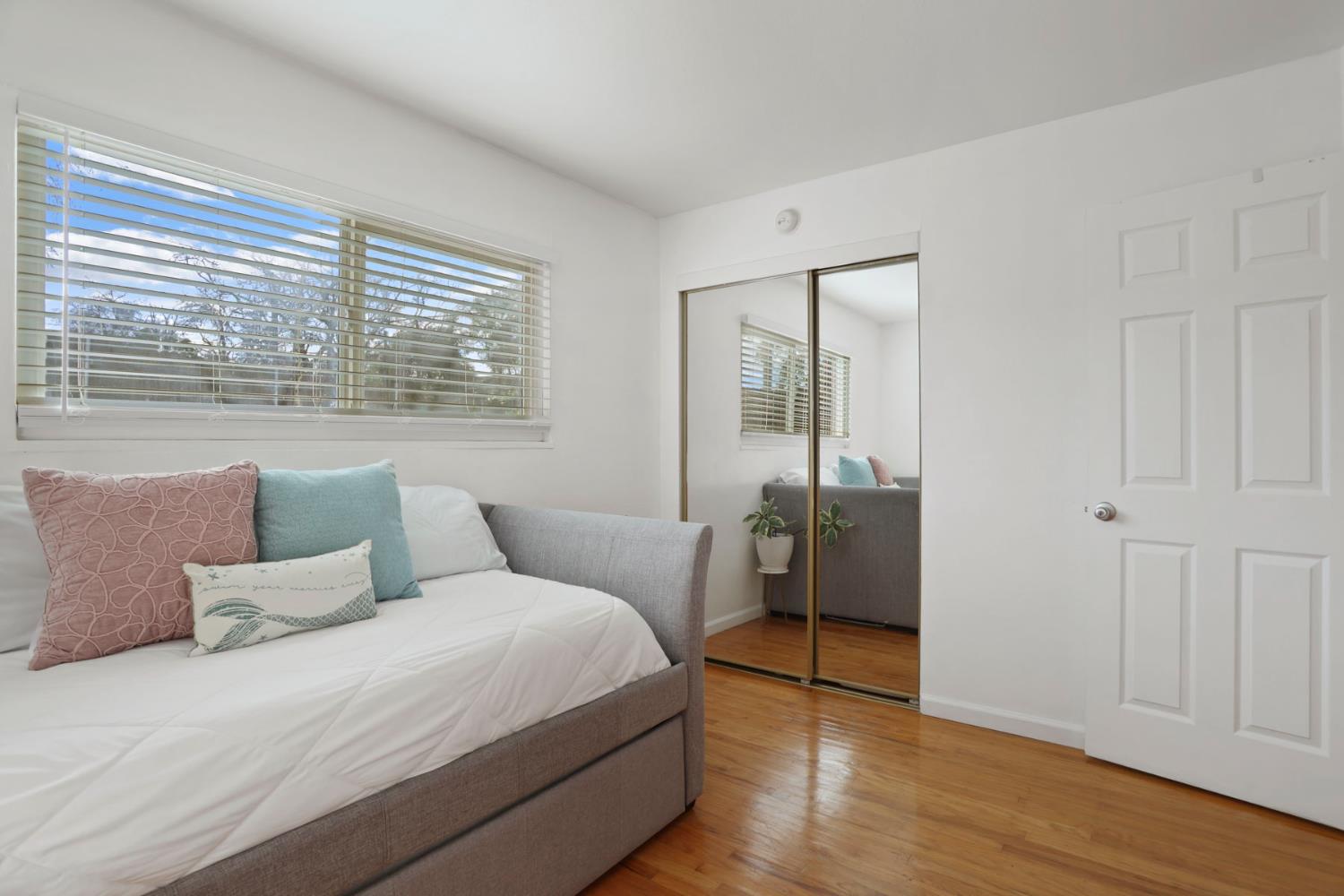 8814 Mohawk Way Fair Oaks, CA 95628 - Photo 21 of 34 a bedroom with a bed and a large window