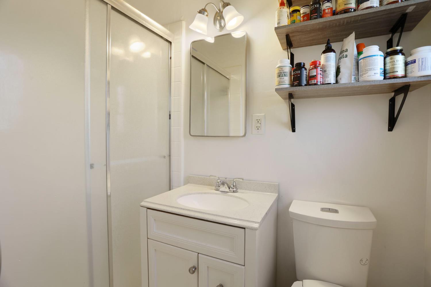 8814 Mohawk Way Fair Oaks, CA 95628 - Photo 24 of 34 a bathroom with a sink vanity and mirror