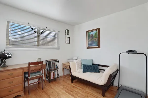 a work room with furniture and windows