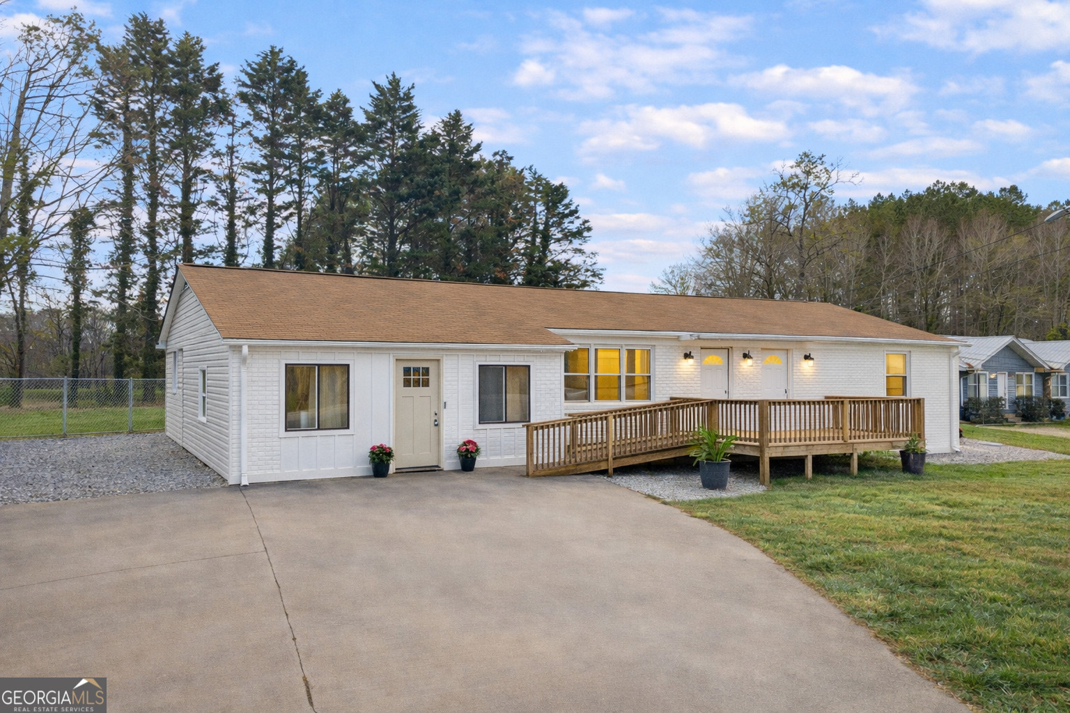 156 White Pine Road Toccoa, GA 30577 - Photo 1 of 55 a front view of a house with a garden and trees