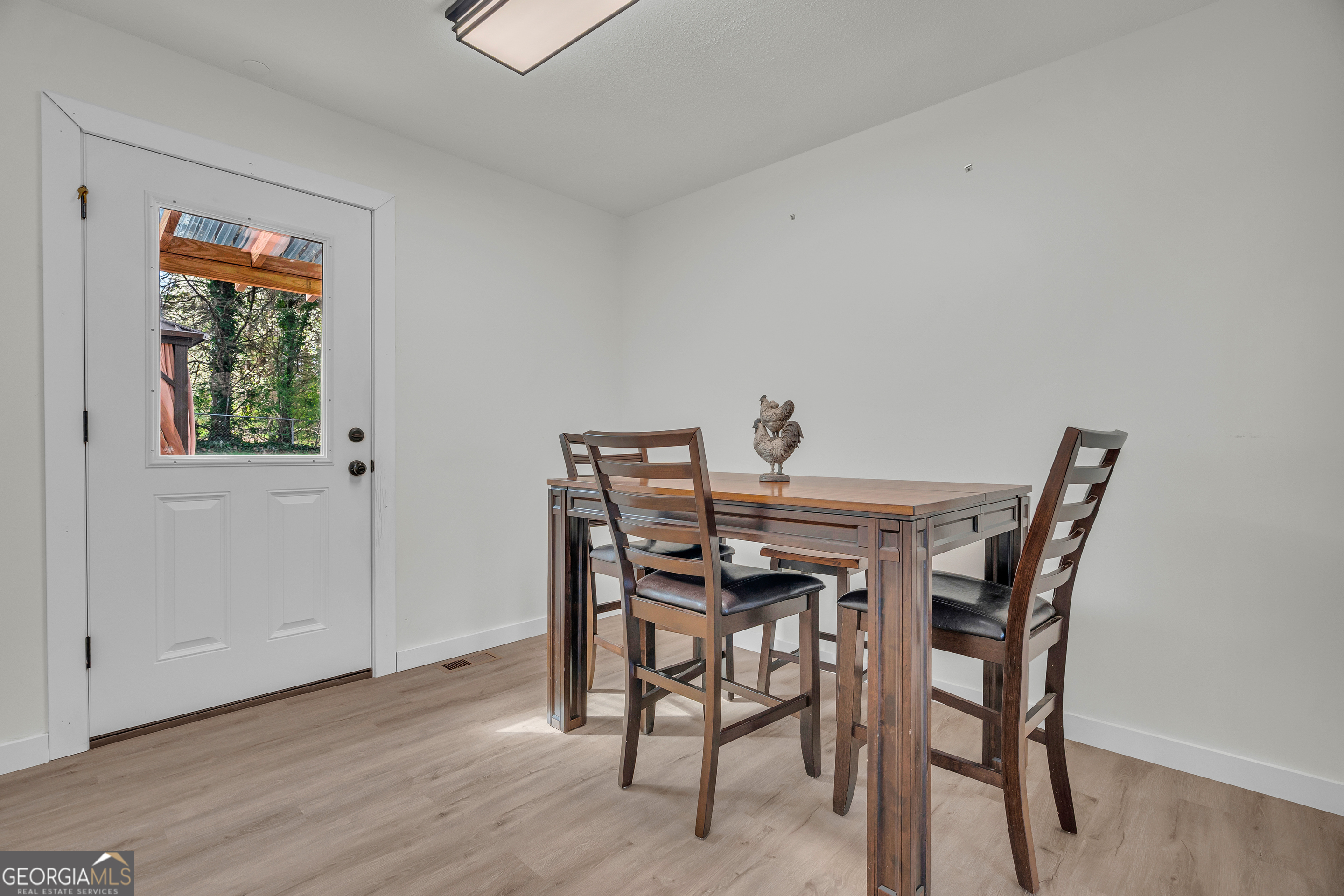 156 White Pine Road Toccoa, GA 30577 - Photo 11 of 57 a view of a dining room with furniture and wooden floor