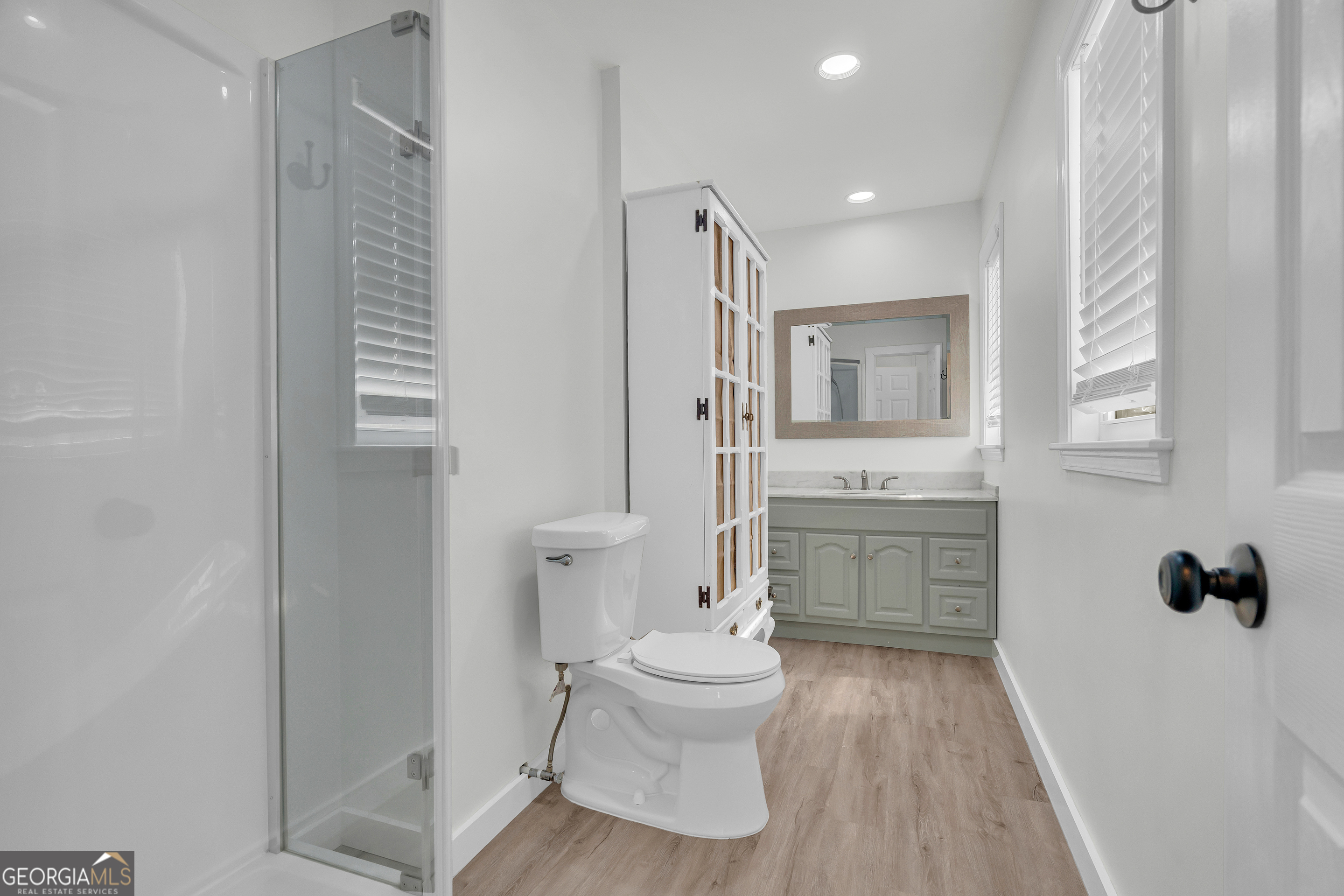 156 White Pine Road Toccoa, GA 30577 - Photo 37 of 57 a bathroom with a sink toilet a mirror and shower