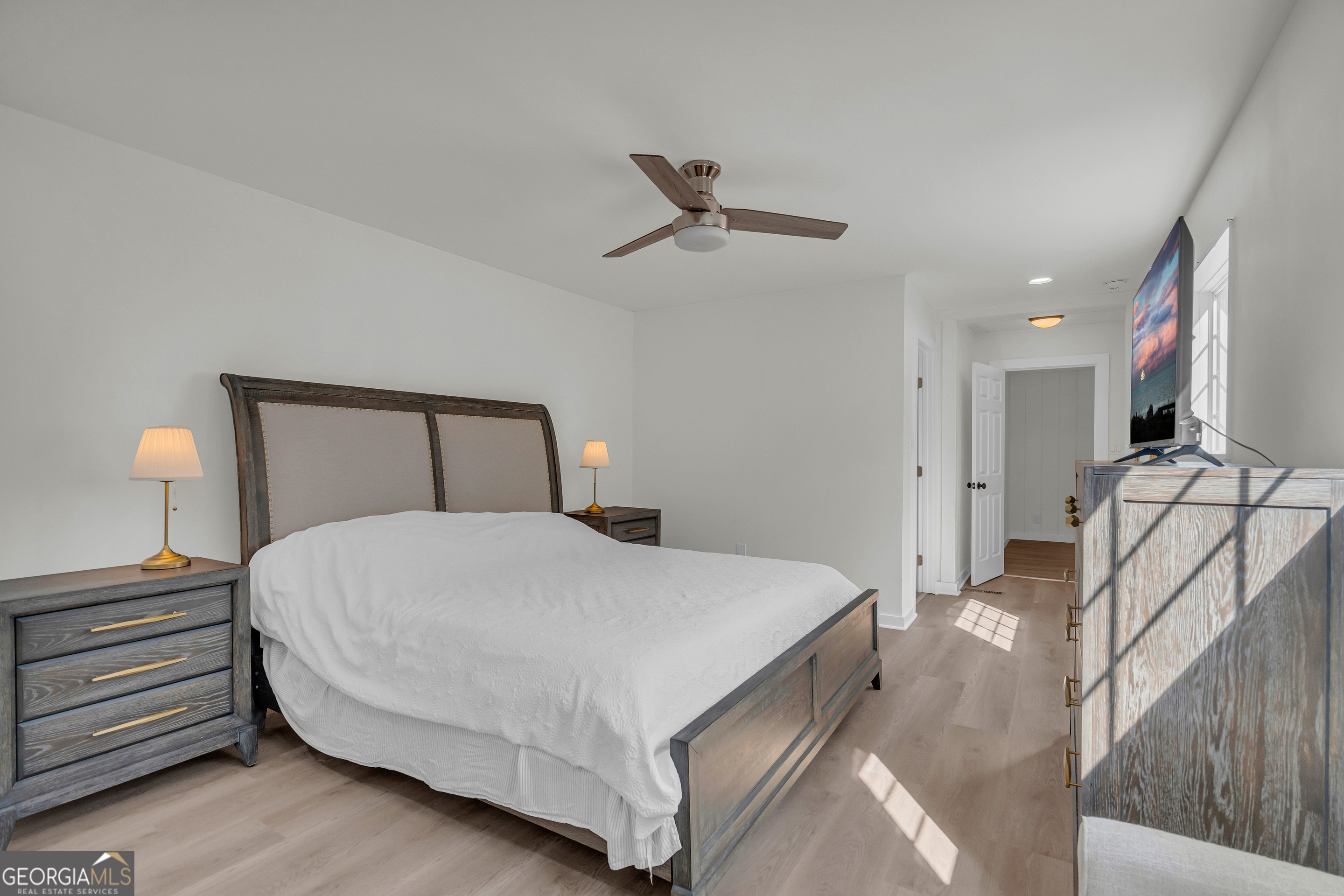 156 White Pine Road Toccoa, GA 30577 - Photo 40 of 55 a bedroom with a bed and a lamp