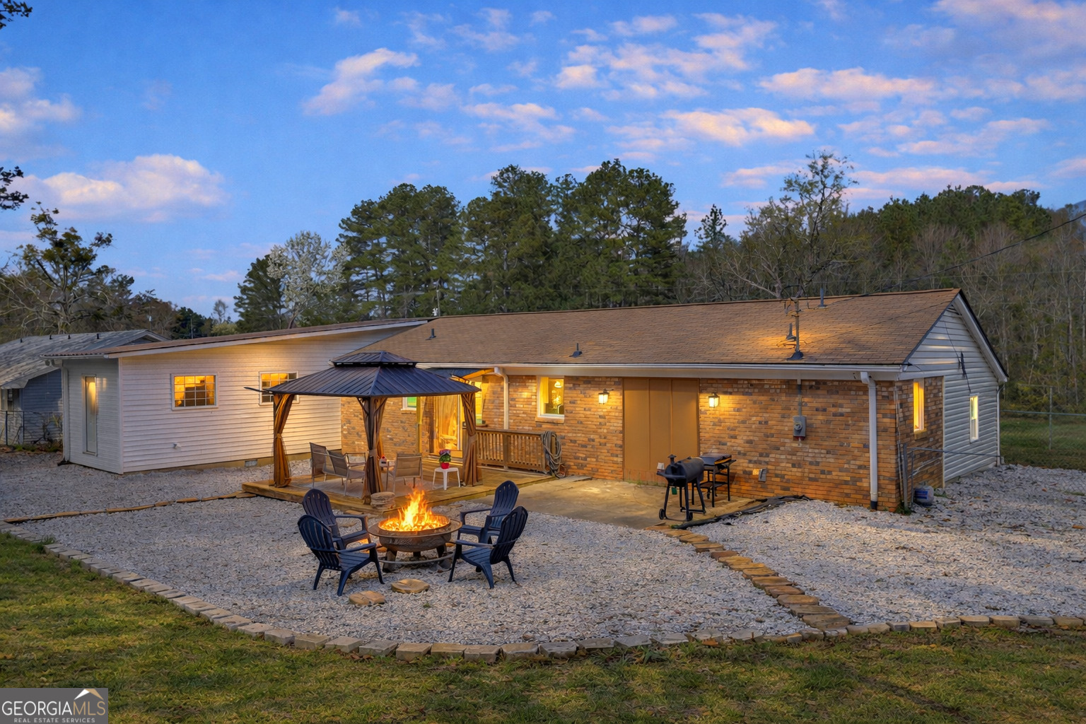 156 White Pine Road Toccoa, GA 30577 - Photo 5 of 57 a backyard of a house with table and chairs