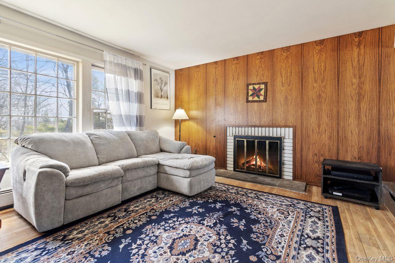 24 Highview Road Ossining, NY 10562 - Photo 8 of 43 Natural hardwood floors with wood burning fireplace.