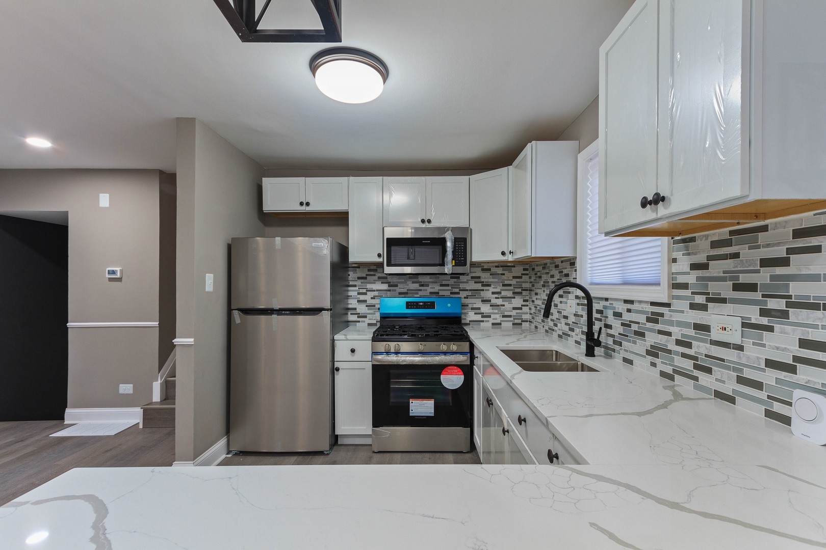 10002 South Normal Avenue Chicago, IL 60628 - Photo 13 of 29 a kitchen with refrigerator and cabinets
