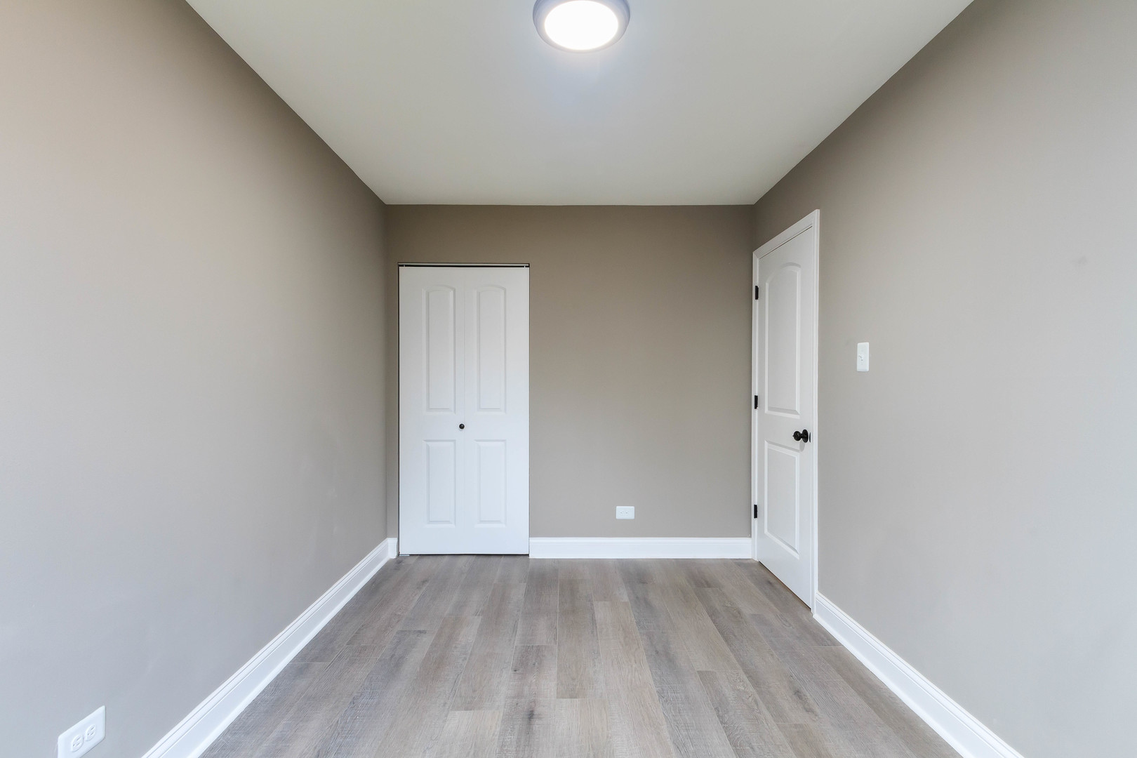 10002 South Normal Avenue Chicago, IL 60628 - Photo 18 of 29 a view of an empty room and wooden floor