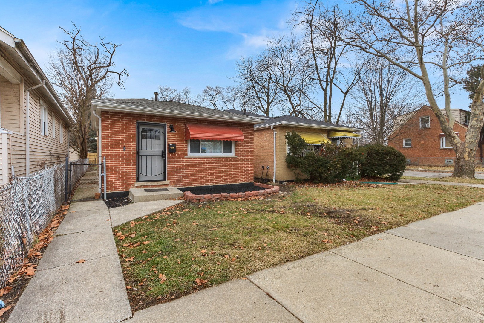 10002 South Normal Avenue Chicago, IL 60628 - Photo 2 of 29 a view of a house with a yard
