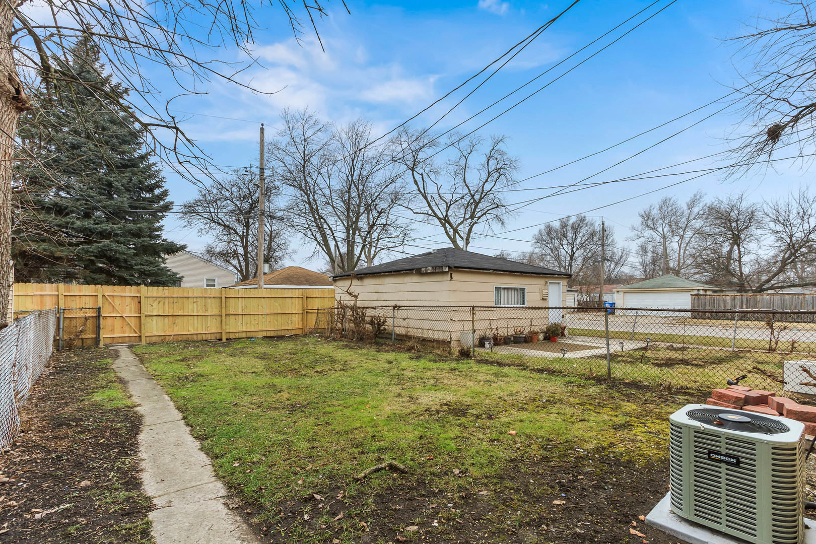 10002 South Normal Avenue Chicago, IL 60628 - Photo 29 of 29 a view of a yard with wooden fence