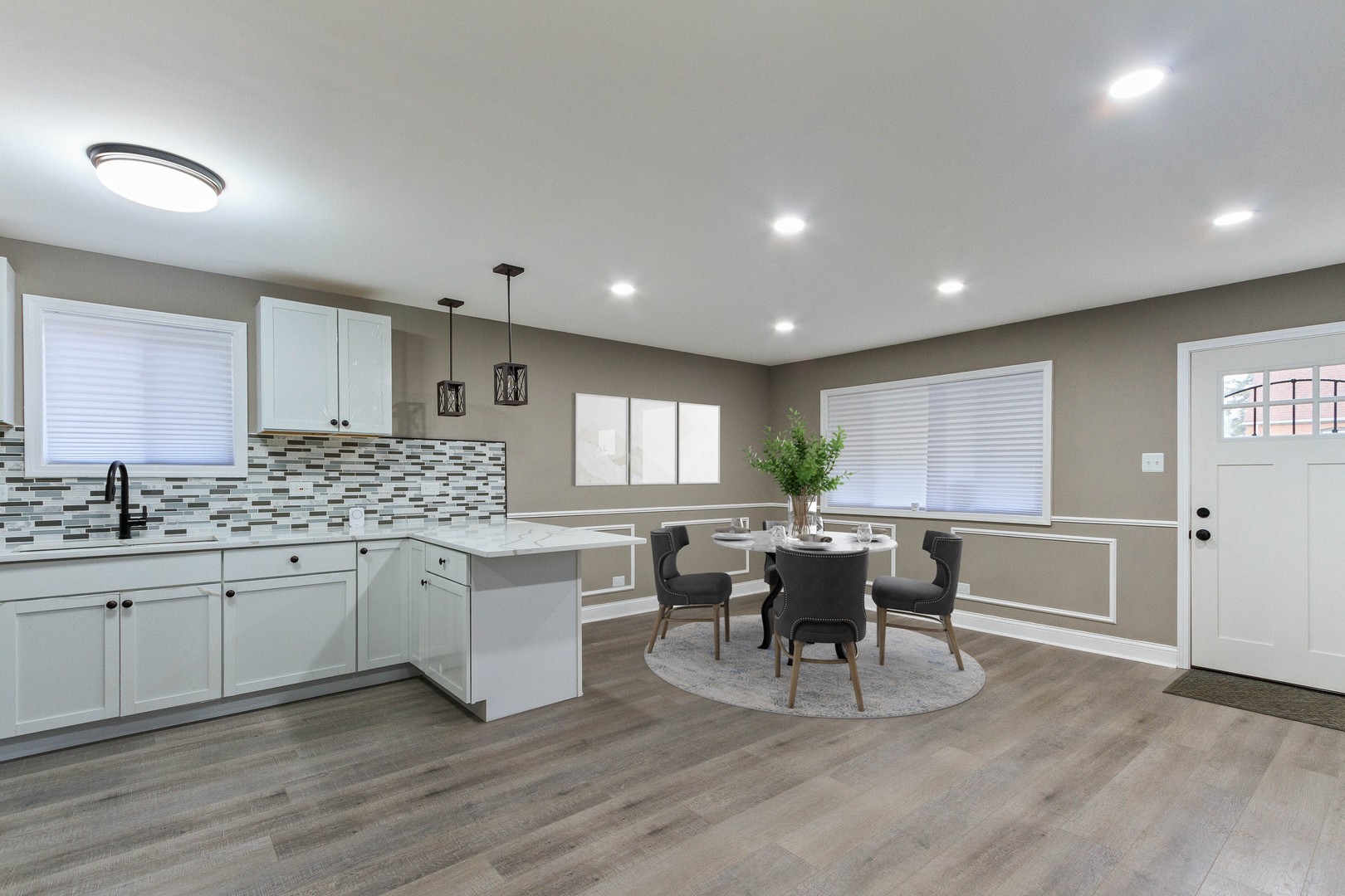 10002 South Normal Avenue Chicago, IL 60628 - Photo 4 of 29 a kitchen with a table and chairs in it